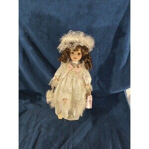 Porcelain Doll wearing pink Dress & Hat White Feather Trim J Misa Collection